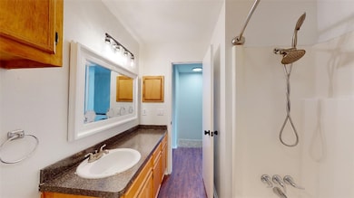 Bathroom featuring  shower combination, wood finis