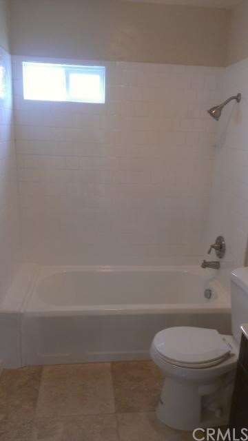 Sharp Looking Full Bathroom With Travertine Floori