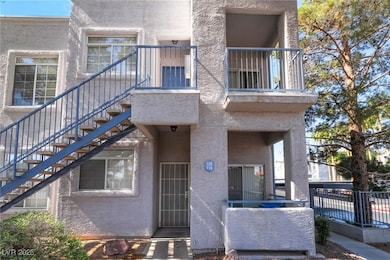 Property entrance with stucco siding