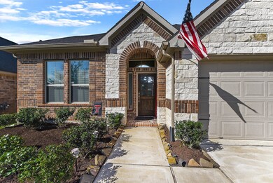 Walk way up to the front door is lined with stone.