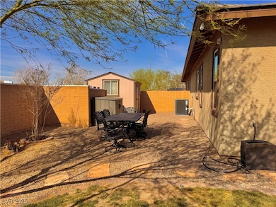 View of yard with a shed, an outdoor structure, a