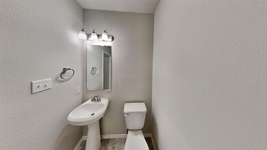 Bathroom with tile patterned flooring and toilet