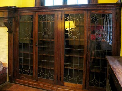 Living Room. Leaded glass built-in bookshelves fla