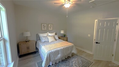 Bedroom with light hardwood / wood-style flooring
