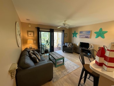 Living area featuring light wood finished floors and ceiling fan