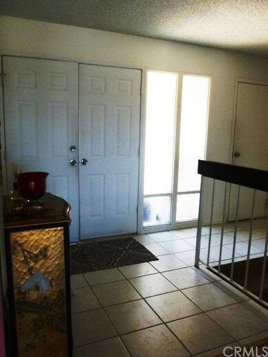Double door entry with tiled floors