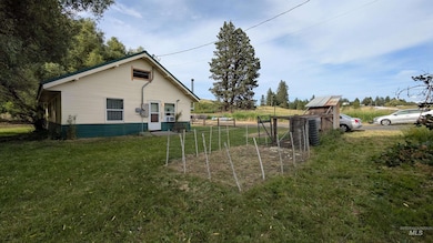 View of home's exterior with a yard
