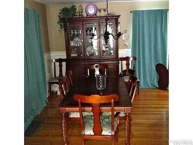 Dining Room hard wood floors and original wainscot