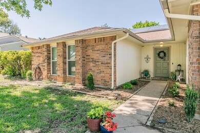View of exterior entry with solar panels