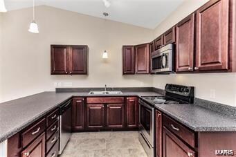 U shaped kitchen viewand cathedral ceiling