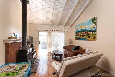 Living room with exposed wood, vaulted ceilings an