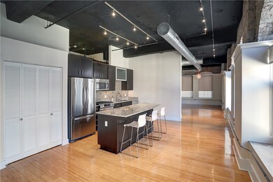 Open floor plan - view of kitchen and coat closet