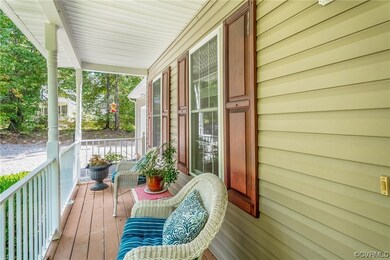 Balcony featuring covered porch