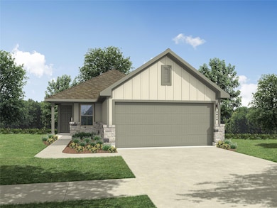 View of front of home with an attached garage, st