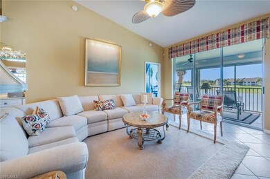 Tiled living area with lofted ceiling and ceiling 