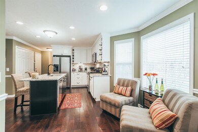 The kitchen also has custom granite countertops & stainless steel appliance. All remain including refrigerator. 
