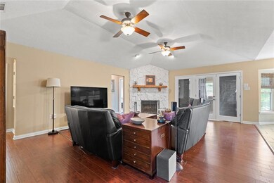 Living Room w Stone Fireplace - gas and wood-burni
