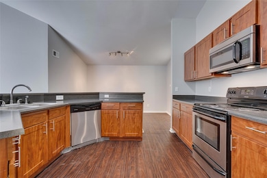 Kitchen featuring appliances with stainless steel