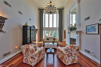 Formal living room with floor-to-ceiling windows, 