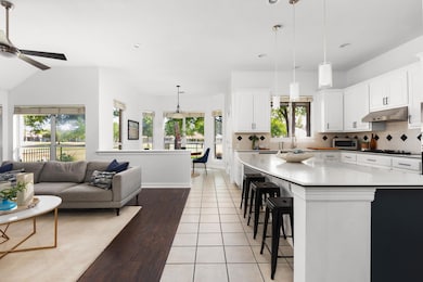 Kitchen featuring under cabinet range hood, ceili