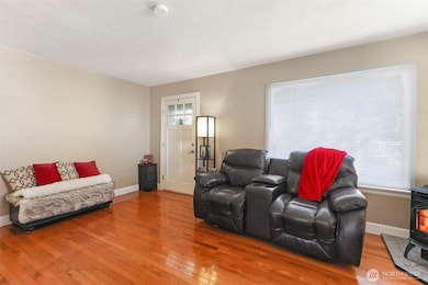 View of entry and living from dining area