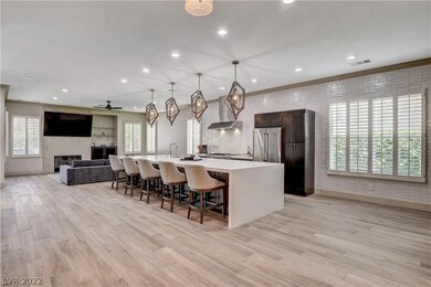 Custom lighting, 15' island, high ceilings and bea