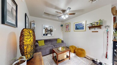 Living room featuring visible vents, baseboards, c