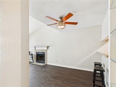 Unfurnished living room with a ceiling fan, wood f