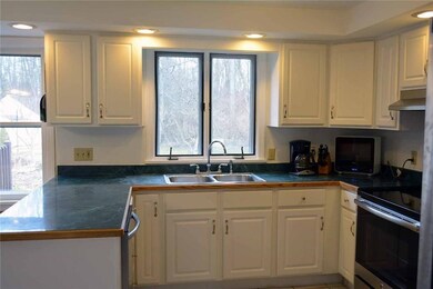 Kitchen with a view!  White wall & base cabinetry,