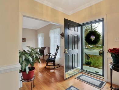 Foyer, 7’ x 11’, nine-foot ceiling, hardwood floor, flush mount light fixture, coat closet.