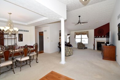 Just inside the entryway, the open floor plan and tall cathedral ceiling welcome visitors.