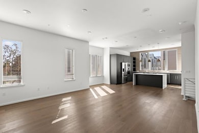 Unfurnished living room with dark wood finished f