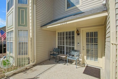 Relax on this front patio area.  New iron fence an