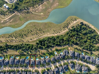 Aerial view with approximate boundary lines and showcasing the extensive walking trails, lake and greenspace behind the home.