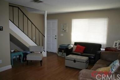 Living Room with Stairs leading to Bedrooms