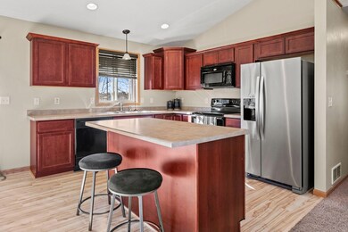 Kitchen includes an island that is also a breakfast bar.