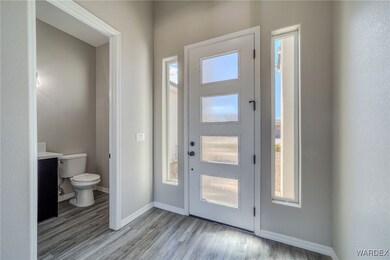 Foyer entrance with a healthy amount of sunlight a