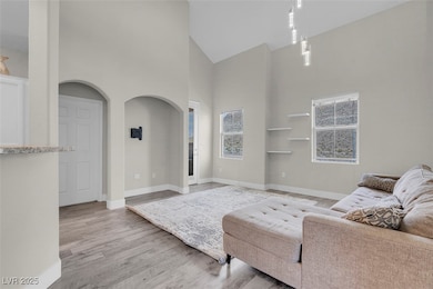 Living room with high vaulted ceiling