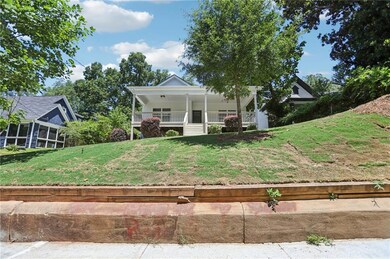 Farmhouse inspired home featuring a front yard and covered porch