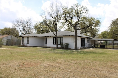 View of front of house featuring an attached carpo