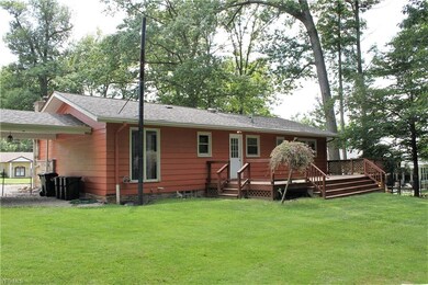 Large deck overlooks your yard and wooded lots behind the home.