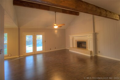 Large fireplace and new flooring.