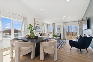 (Photo of decorated model, actual home's finishes will vary) Soaked in natural sunlight, the homes great room is a great place to spend time!