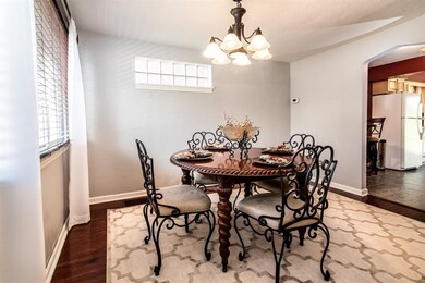 Freshly painted Dining Room with hardwood floors a