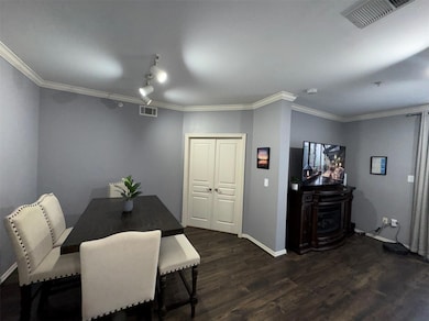Dining area featuring dark wood-type flooring and 