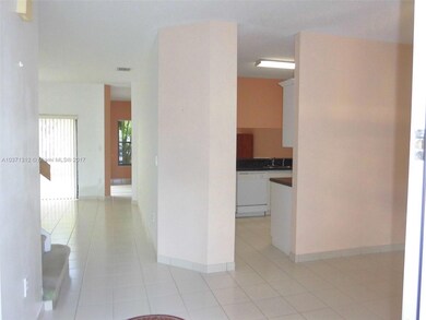 VIEW FRON ENTRANCEWAY, KITCHEN,FAM & LIV ROOM