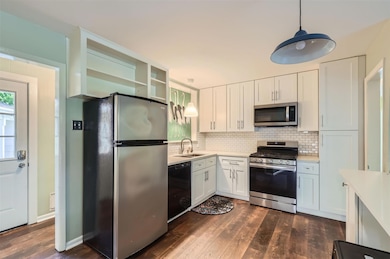 Kitchen with stainless steel appliances, light co