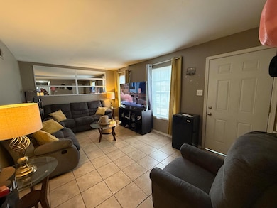 Living area featuring tile patterned floors
