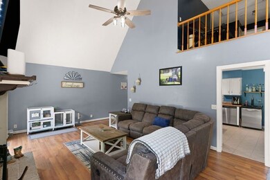 Large family room with vaulted ceilings and firepl