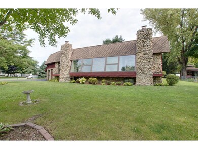 Huge wall of glass overlooks the front yard and of